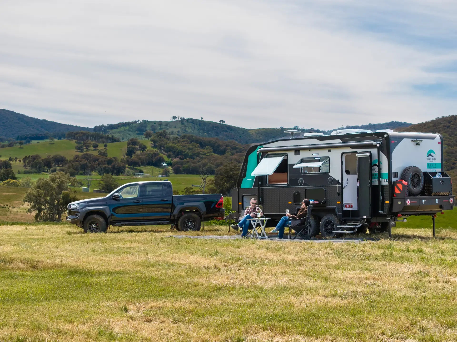 Snowy River multi-terrain caravan camped beside a river