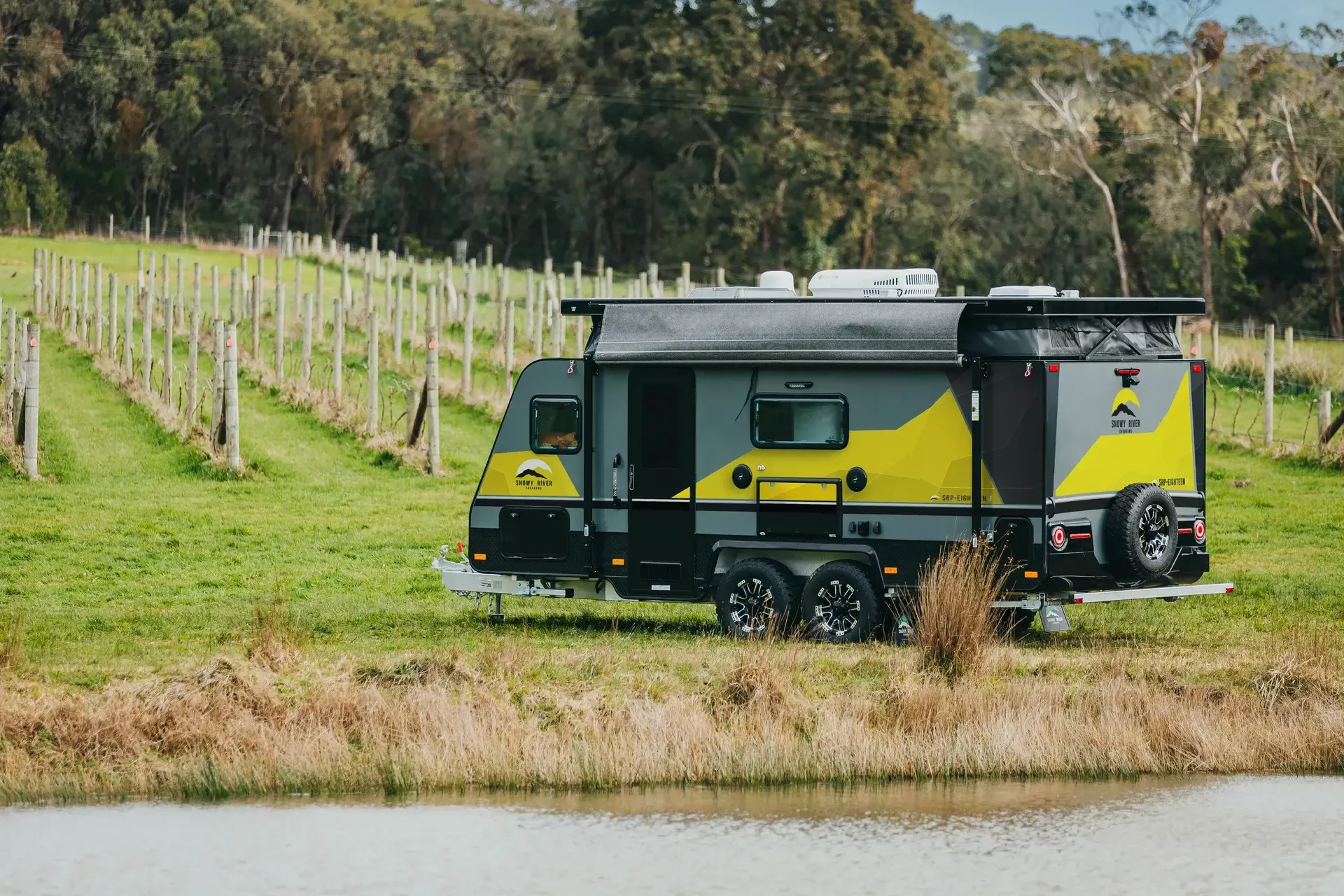 Family caravan parked near a vineyard