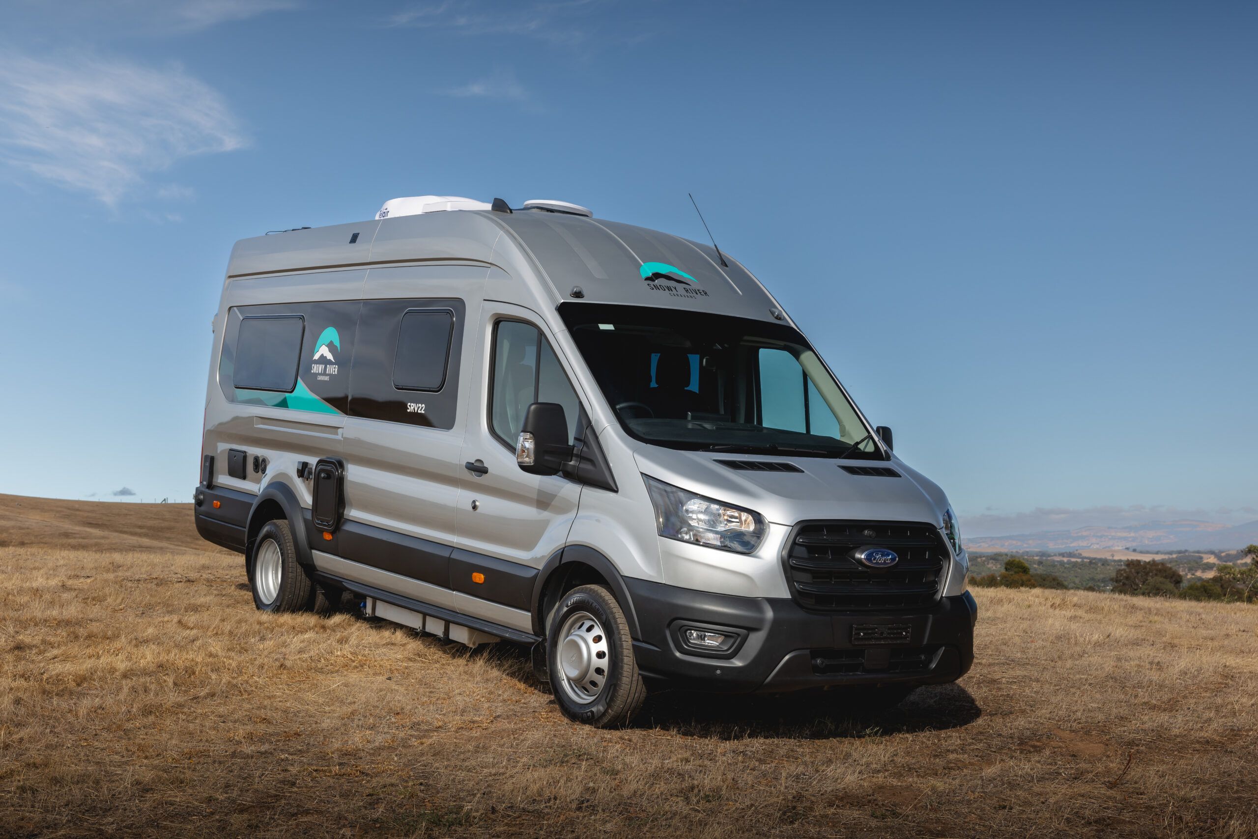 Front view of the SRV-22 campervan in the countryside