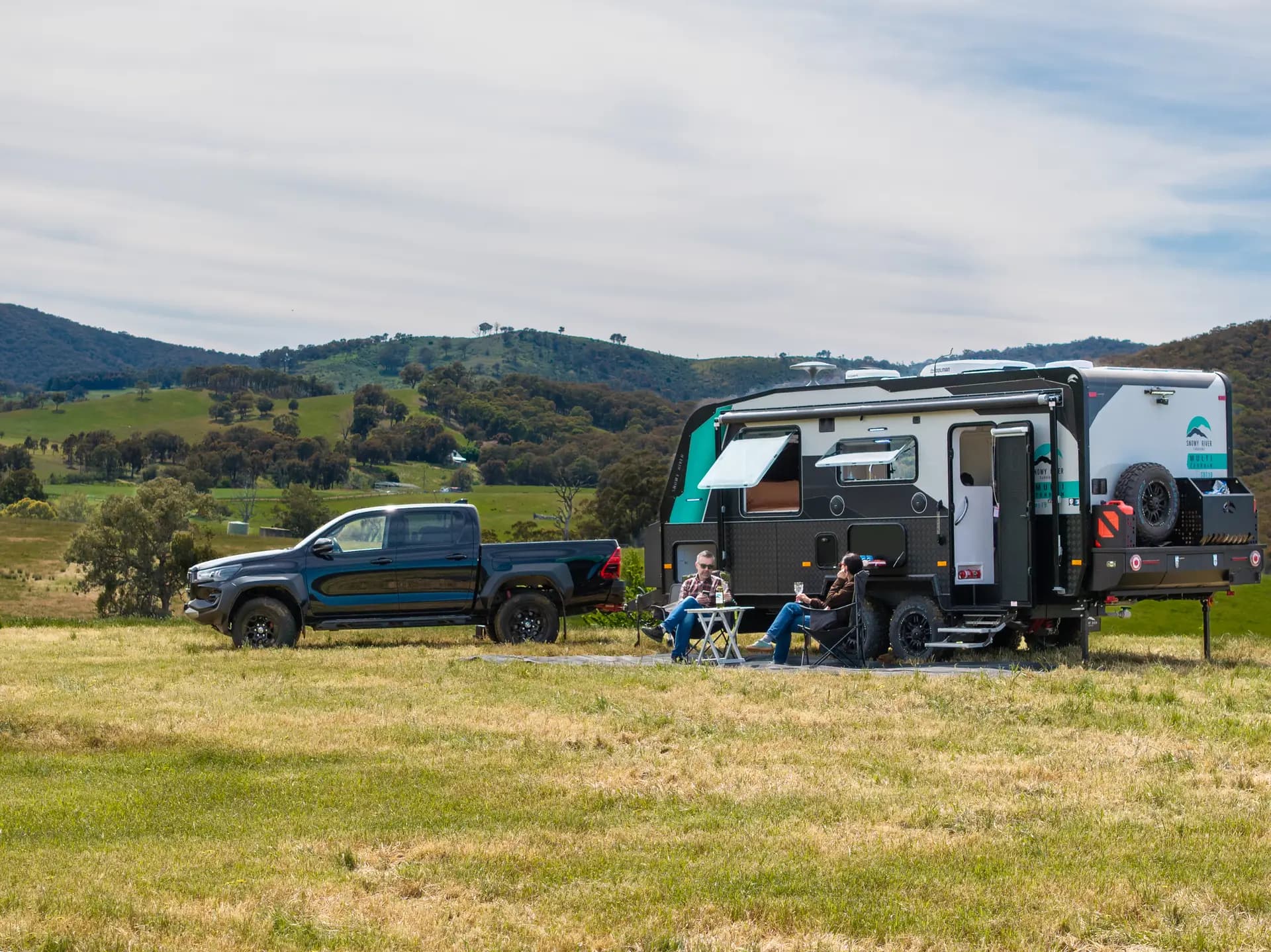 Snowy River multi-terrain caravan camped beside a river